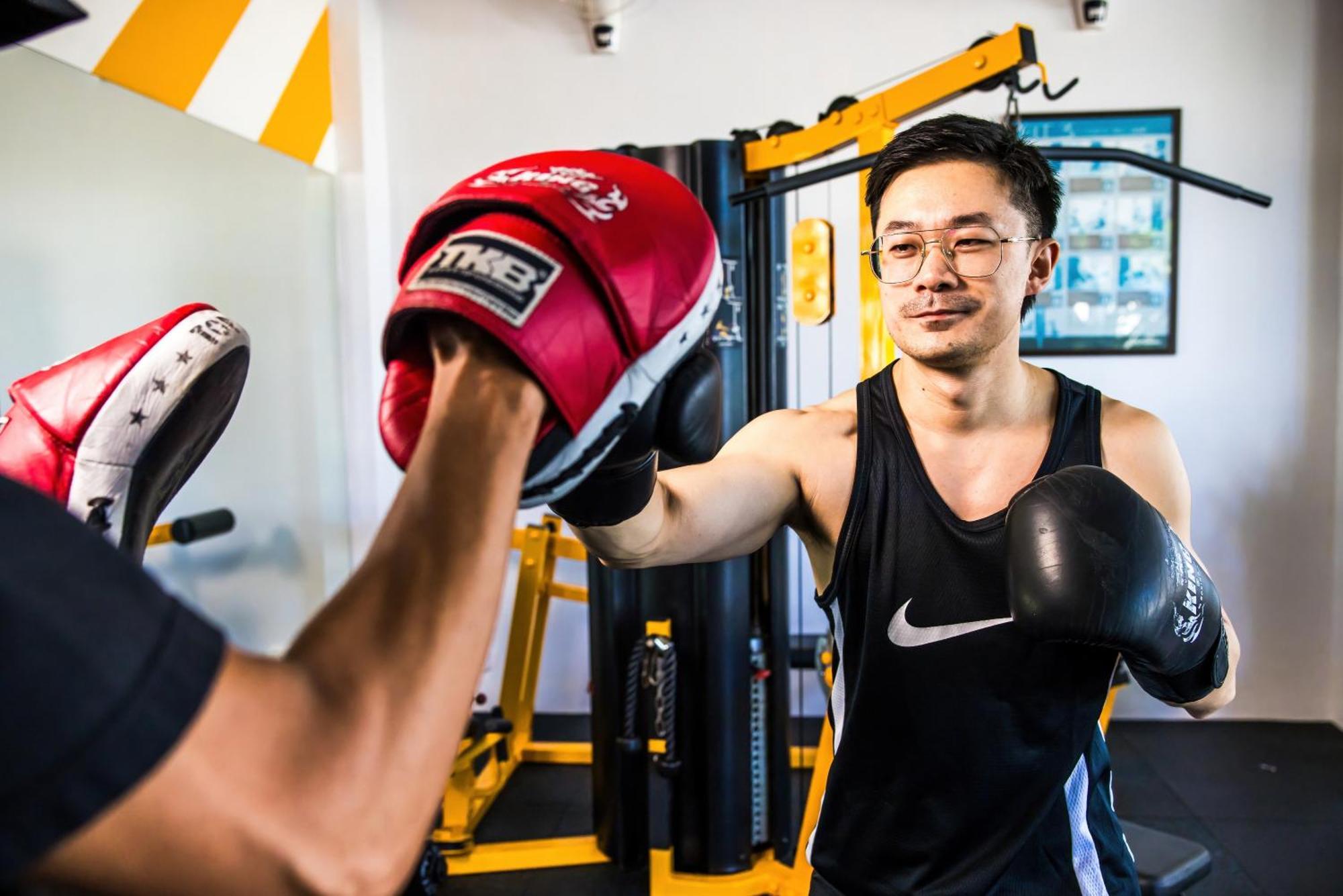 Grand Mercure Phuket Patong Εξωτερικό φωτογραφία A boxer training with a heavy bag